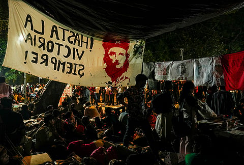 Cockroach Janata Party (CJP) supporters rest at the Jantar Mantar, as they gather ahead of a protest march, in New Delhi, early Monday, July 20, 2026. 
