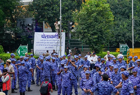 Security personnel keeps a vigil ahead of protest march by Cockroach Janata Party (CJP) supporters, near the Jantar Mantar at Sansad Marg, in New Delhi, Monday, July 20, 2026. 