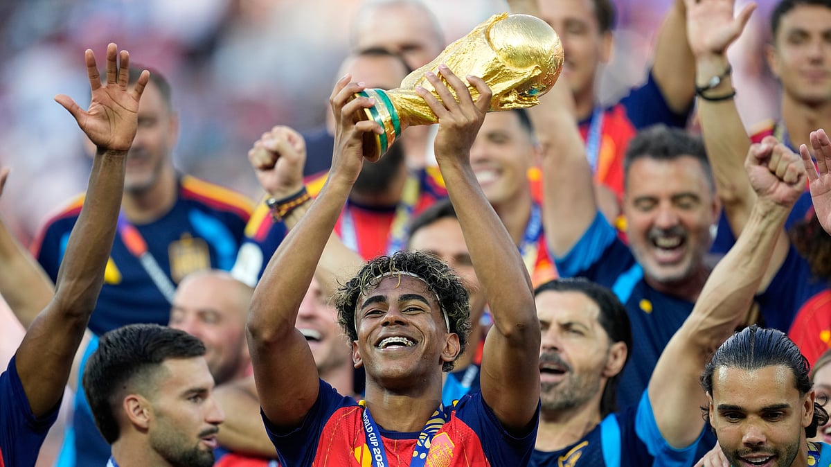 Spain's Lamine Yamal celebrates with the trophy after winning the World Cup final soccer match between Spain and Argentina in East Rutherford, N.J., near New York, Sunday, July 19, 2026. - (AP Photo/Ashley Landis)