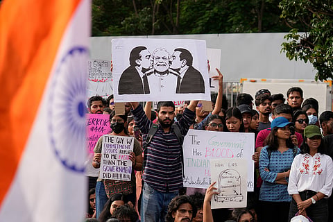 People attend a protest as part of a youth-led campaign demanding educational reforms in Bengaluru, India.