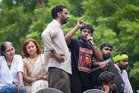 Cockroach Janata Party (CJP) founder Abhijeet Dipke speaks following a protest demanding the resignation of Union Education Minister Dharmendra Pradhan over alleged irregularities in the NEET examination, at Jantar Mantar, in New Delhi, Monday, July 20, 2026. Gitanjali J Angmo, wife of educator and climate activist Sonam Wangchuk and others are also seen.
