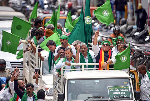 Farmers take out a rally during the observance of Raitha Shaheed Dinacharane (Farmer Martyrs' Day), while protesting over various demands, in Chikkamagaluru, Karnataka.