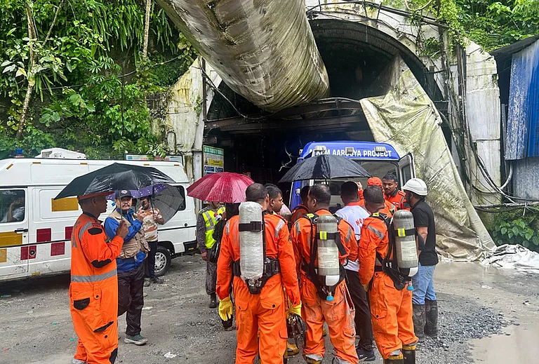 Police personnel at site as rescue operation is underway after 27 workers were trapped in an under construction tunnel after a landslide, in Gangtok, Sikkim, Tuesday, July 21, 2026. - | Photo: AP