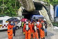 In Photos: Rescue Teams Race Against Time After Deadly Sikkim Tunnel Collapse | Photo: AP : Police personnel at site as rescue operation is underway after 27 workers were trapped in an under construction tunnel after a landslide, in Gangtok, Sikkim, Tuesday, July 21, 2026.