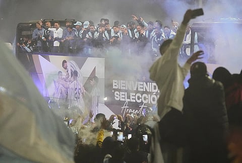 The bus carrying Argentina's team heads to the Argentine Football Association headquarters in Ezeiza, on the outskirts of Buenos Aires, Monday, July 20, 2026, after returning from the World Cup final, where they lost to Spain.