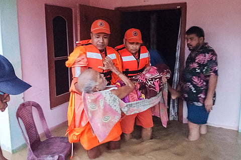 In this image posted on July 20, 2026, NDRF officials conduct a rescue operation in a flood-affected area, in Assam.