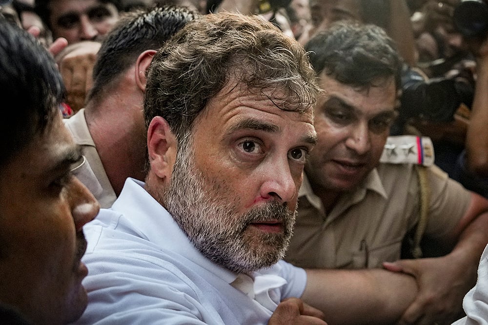Police personnel detain Leader of Opposition in the Lok Sabha Rahul Gandhi during a sit-in protest near the Prime Minister's residence over alleged irregularities in the NEET examination, in New Delhi. - | Photo: PTI/Arun Sharma