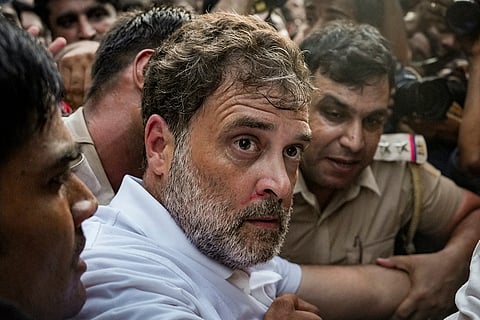 Police personnel detain Leader of Opposition in the Lok Sabha Rahul Gandhi during a sit-in protest near the Prime Minister's residence over alleged irregularities in the NEET examination, in New Delhi.