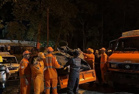 Rescue personnel conduct rescue operations after about 27 workers are trapped inside an under-construction tunnel after a landslide blocked its entrance and triggered a suspected gas leak, in Namchi district, Sikkim. 