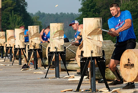 Athletes compete in the men's standing chop during the Lumberjack World Championships, Saturday, July 18, 2026, in Hayward, Wisconsin. 