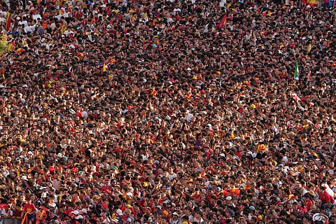 Fans crowd together as they wait for the arrival of players from Spain's national soccer team in Madrid on Monday, July 20, 2026, after Spain defeated Argentina in the World Cup final in East Rutherford, N.J., near New York. 