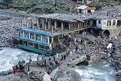 Residents and rescue workers inspect buildings damaged by heavy flooding in the eastern province of Nuristan, Afghanistan, Tuesday, July 21, 2026. - | Photo: AP/Wahidullah Kakar