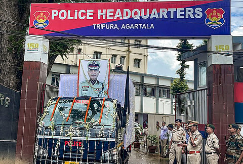Security personnel stand beside a truck carrying the mortal remains of late Director General of Police (DGP) Anurag Dhankar, at Tripura Police Headquarters, Tripura.