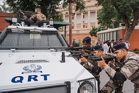 Security personnel remain on alert as Prime Minister Narendra Modi leaves Parliament after attending the Monsoon Session, in New Delhi, Monday, July 20, 2026. Security was heightened in the wake of protests in central Delhi over alleged NEET examination irregularities.