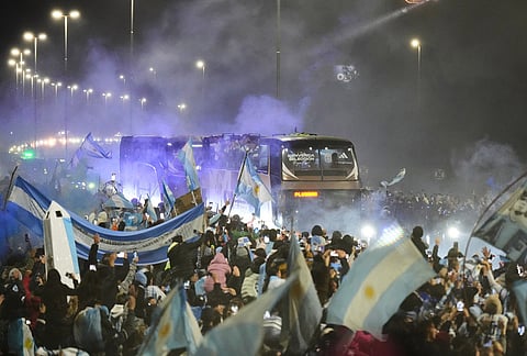 The bus carrying Argentina's team heads to the Argentine Football Association headquarters in Ezeiza, on the outskirts of Buenos Aires, Monday, July 20, 2026, after returning from the World Cup final, where they lost to Spain.