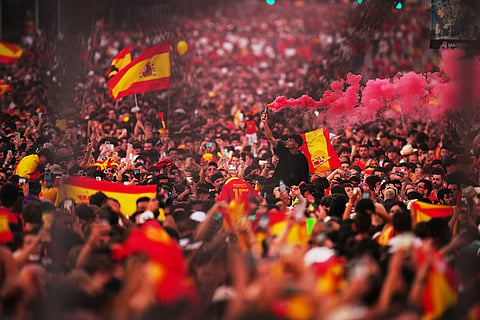 Fans wait for the arrival of players from Spain's national soccer team during celebrations in Madrid on Monday, July 20, 2026, after Spain defeated Argentina in the World Cup final in East Rutherford, N.J., near New York.