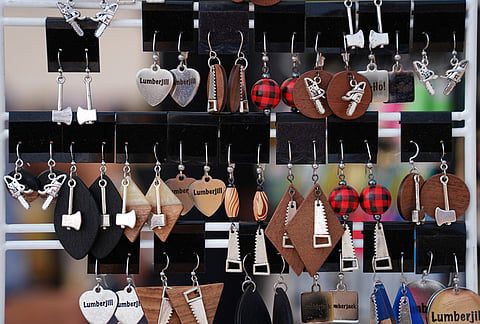 Custom lumberjack-themed earrings are displayed for sale during the Lumberjack World Championships, Saturday, July 18, 2026, in Hayward, Wisconsin. 