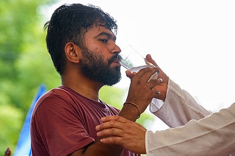 Cockroach Janta Party (CJP) founder Abhijeet Dipke breaks his 48-hour hunger strike at Jantar Mantar, ahead of the 'Chalo Sansad' protest demanding the resignation of Union Education Minister Dharmendra Pradhan over alleged irregularities in the NEET examination, in New Delhi.