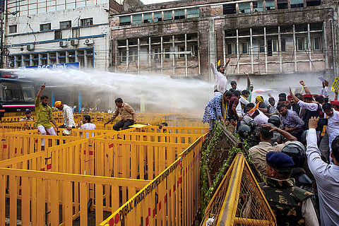 Police use water cannons to disperse activists of the OBC Mahasabha during a protest over the reservation issue, in Bhopal.