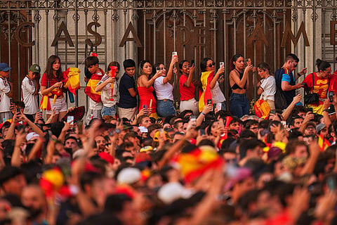 Fans crowd together as they wait for the arrival of players from Spain's national soccer team during celebrations in Madrid on Monday, July 20, 2026, after Spain defeated Argentina in the World Cup final in East Rutherford, N.J., near New York.