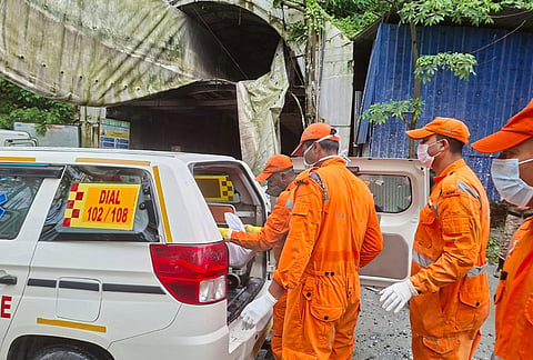 Rescue workers carry the body of a victim into an ambulance outside the entrance to an under-construction tunnel at a hydropower project in Samardung village, about 40 kilometers (25 miles) from Gangtok, Tuesday, July 21, 2026. 