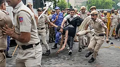 Security personnel detain CJP supporters | July 20, 2026. - PTI/KARMA