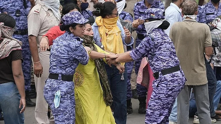 Security personnel stop Cockroach Janata Party (CJP) supporters during a protest march, near the Parliament in New Delhi - Tribhuvan Tiwari/Outlook