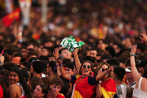 Fans crowd together as they wait for the arrival of players from Spain's national soccer team during celebrations in Madrid on Monday, July 20, 2026, after Spain defeated Argentina in the World Cup final in East Rutherford, N.J., near New York.
