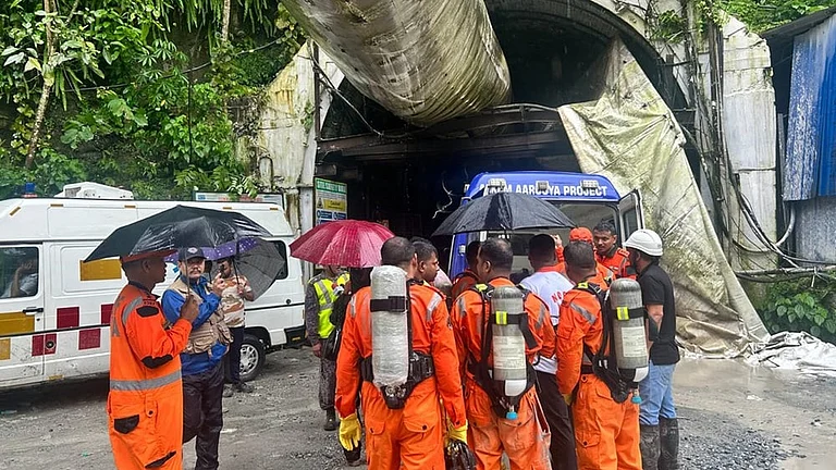 Police personnel at site as rescue operation is underway after 27 workers were trapped in an under construction tunnel after a landslide, in Gangtok, Sikkim, Tuesday, July 21, 2026. - | Photo: AP