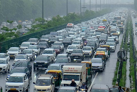 Vehicles remain stuck in a traffic jam on Delhi-Gurugram Expressway amid rainfall, in Gurugram, Haryana.