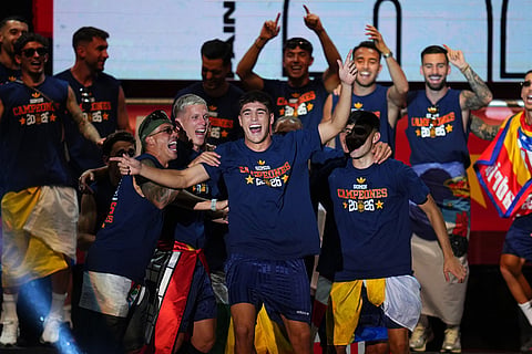 Spain's Pau Cubarsi, center, during celebrations with his national team teammates at Cibeles Square in Madrid on Monday, July 20, 2026, after Spain defeated Argentina in the World Cup final in East Rutherford, N.J., near New York. 