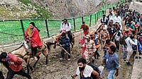 | Photo: PTI : Pilgrims proceed towards the holy cave shrine of Amarnath during the ongoing 'Amarnath Yatra', in Jammu.