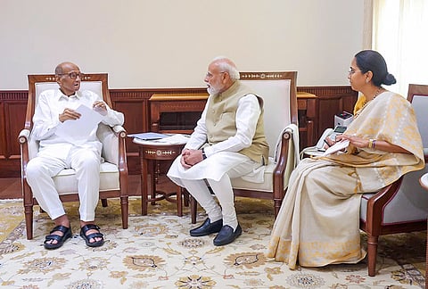 Prime Minister Narendra Modi interacts with NCP (SP) President Sharad Pawar during a meeting, at Parliament House, in New Delhi. Party MP Supriya Sule is also seen. 