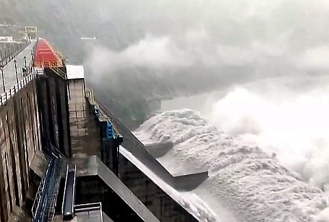 Water gushes through the opened gates of the Salal Dam as the Chenab river swells amid heavy rainfall, in Reasi district, Jammu and Kashmir.