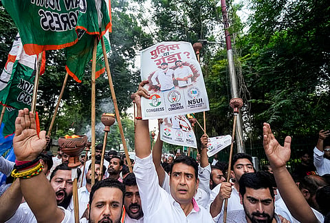 Uttar Pradesh Youth Congress workers take out a torchlight march demanding a probe into the alleged NEET paper leak and the dismissal of Union Education Minister Dharmendra Pradhan, in Lucknow, Tuesday, July 21, 2026. 