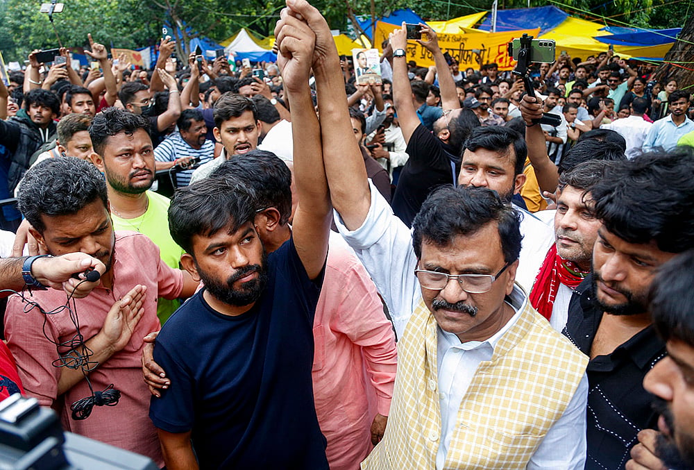 Shiv Sena (UBT) MP Sanjay Raut with Cockroach Janata Party founder (CJP) Abhijeet Dipke