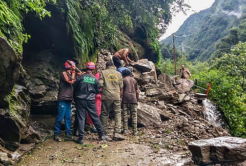 Disaster response personnel inspect the Kedarnath pedestrian route near Chhodi, about 1 km from Gaurikund, after falling boulders triggered by overnight rain blocked the path, in Rudraprayag district, Uttarakhand. Pilgrims were stopped at safe locations as a precaution. 