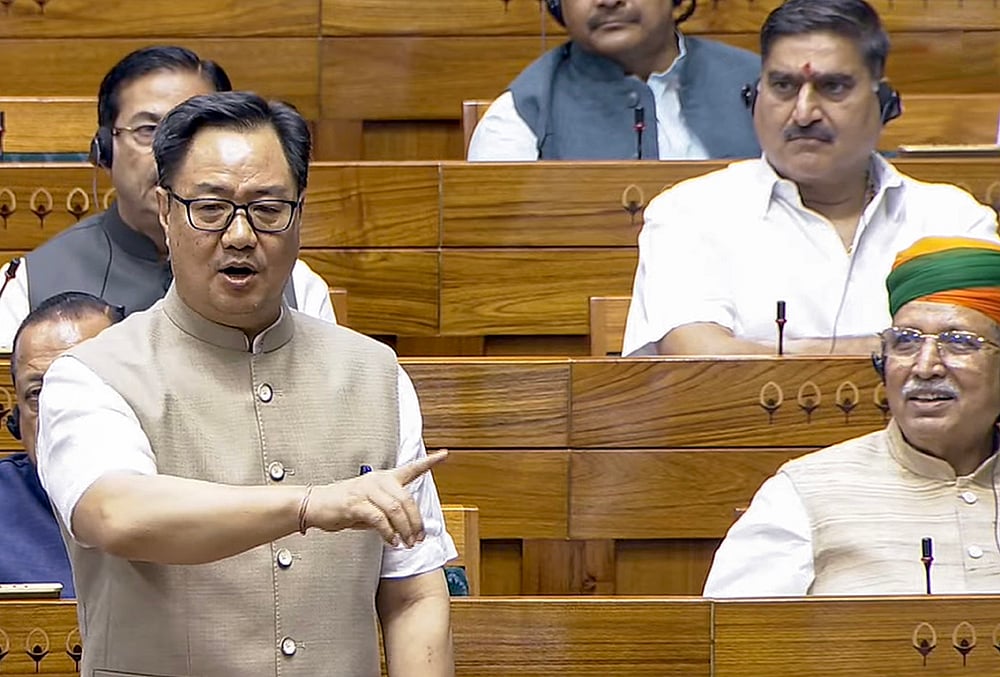 Union Minister of Parliamentary Affairs Kiren Rijiju speaks in the Lok Sabha during the Monsoon Session of the Parliament, in New Delhi. - Sansad TV via PTI 