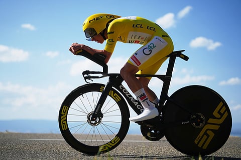 Slovenia's Tadej Pogacar, wearing the overall leader's yellow jersey, rides during the sixteenth stage of the Tour de France cycling race, an indivdual time-trial with start in Evian-Les-Bains and finish in Thonon-les-Bains, France.