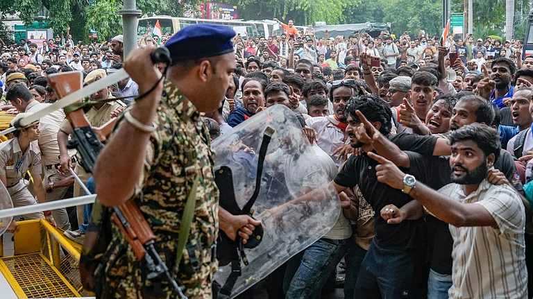 Security Personnel stop Cockroach Janata Party (CJP) Supporters During A Protest March - Money Sharma