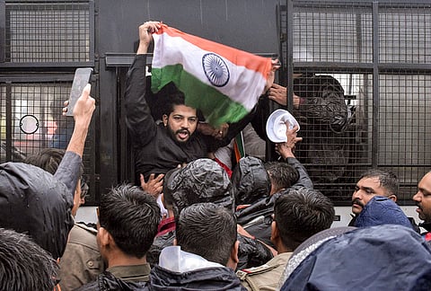Congress workers being detained by police personnel after they staged a protest condemning the detention of Lok Sabha LoP Rahul Gandhi and other party leaders during a sit-in protest outside PM's residence in Delhi, and demanding accountability over alleged examination irregularities in the NEET examination, in Surat, Gujarat.