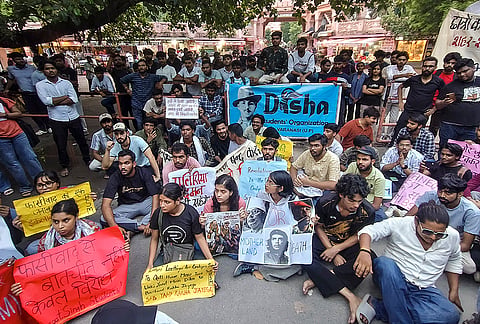 Banaras Hindu University students stage a protest against the police action on the Cockroach Janta Party supporters during their parliament march, in Varanasi, Tuesday, July 21, 2026. 
