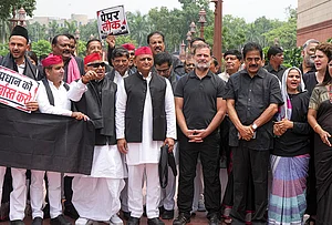 | Photo: PTI/Arun Sharma : Leader of Opposition in Lok Sabha Rahul Gandhi, Congress MPs KC Venugopal and Priyanka Gandhi Vadra, Samajwadi Party (SP) MPs Akhilesh Yadav, Dharmendra Yadav and Awadhesh Prasad and other opposition leaders stage a protest wearing black clothes to express solidarity with students protesting against the NEET paper leak issue, during the Monsoon session of Parliament, in New Delhi.
