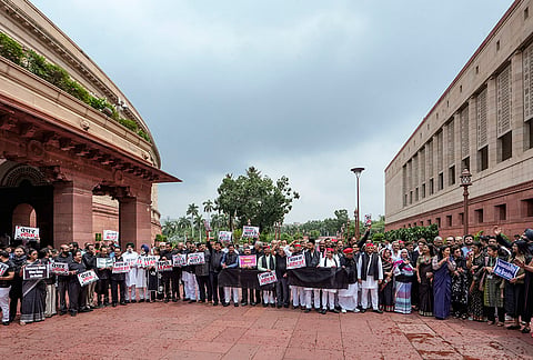 Opposition leaders stage a protest wearing black clothes to express solidarity with students protesting against the NEET paper leak issue, during the Monsoon session of Parliament, in New Delhi. 
