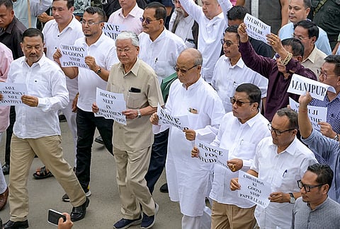 Congress workers hold placards as they take out a protest rally towards Lok Bhavan condemning the detention of Lok Sabha LoP Rahul Gandhi and other party leaders during a sit-in protest outside PM's residence in Delhi, and demanding accountability over alleged examination irregularities, in Imphal, Manipur.