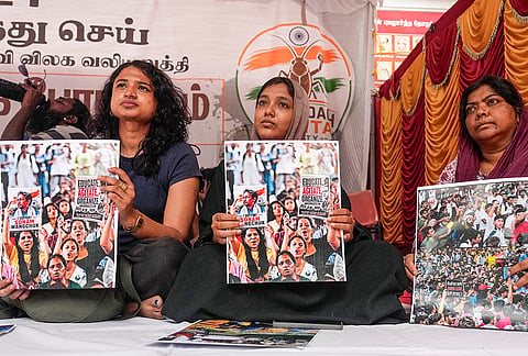 Members of the Cockroach Janta Party (CJP) stage a protest demanding the resignation of Union Education Minister Dharmendra Pradhan over alleged irregularities in the National Eligibility-cum-Entrance Test (NEET), claiming it deprives underprivileged students of equal educational opportunities, at the Communist Party of India (CPI) headquarters, in Chennai, Tuesday, July 21, 2026. 