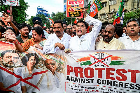 BJP workers stage a protest against the sit-in demonstration by LoP in Lok Sabha Rahul Gandhi and other Congress leaders near the PM's residence in Delhi on Tuesday, in Kolkata, West Bengal.
