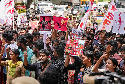 Students' Federation of India (SFI) and Democratic Youth Federation of India (DYFI) activists carry posters during a protest march demanding resignation of Union Education Minister Dharmendra Paradhan over the NEET paper leak issue, in Chennai, Tamil Nadu.