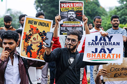 Student activists hold placards during a students' solidarity protest against alleged paper leak scams and violence against students, at the Osmania University, in Hyderabad.
