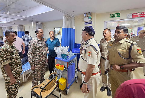 Special CP Crime Devesh Chandra Srivastava meets an injured policeman getting treatment at the Ram Manohar Lohia (RML) Hospital, in New Delhi. At least two assistant commissioners of police (ACPs) and four personnel were injured in a stone-pelting incident by protesters during an ongoing agitation by the Cockroach Janata Party (CJP) near Jantar Mantar on Wednesday evening, police sources said. 